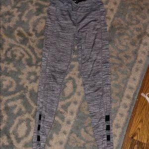 Gray legging with slots on the ankeles